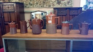 6 brown pottery coffee pots and jugs