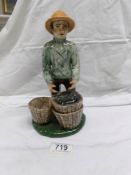 A figure of a fisherman by Coll pottery,