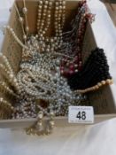 A box of necklaces including pearls