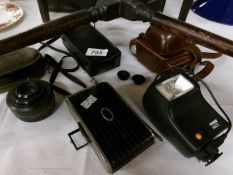 A mixed lot of vintage photographic items comprising Agfa Folding camera, Weston master light meter,