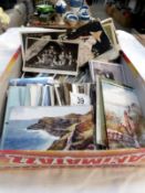 A box of assorted post cards
