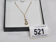 An 18ct gold pendant set diamond