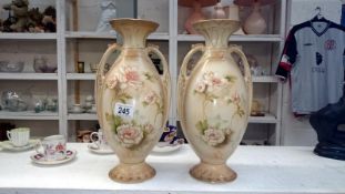 A pair of Edwardian floral vases