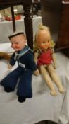 A vintage sailor doll and one other