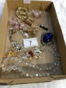 A quantity of brooches and a crystal necklace