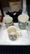 A cow creamer and 3 tankards