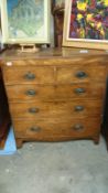 A 2 over 3 oak chest of drawers