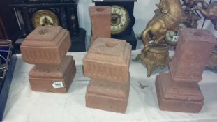 4 terracotta plinths