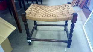 An oak barley twist leg stool