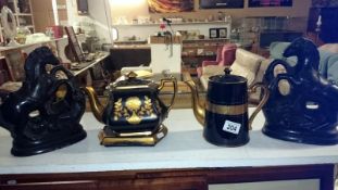 A Mourning ware teapot on stand and a teapot