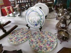 A pair of ceramic cake plates and one other