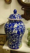 A large blue pottery lidded jar