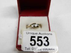 An 18ct yellow gold 3 stone crossover diamond ring,