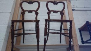 A pair of cane seated bedroom chairs,