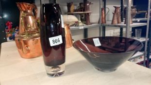 A red glass vase and bowl