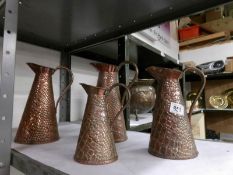 A set of 4 1930's J S & S Joseph Sankey Lizard skin copper jugs numbered 1-4
