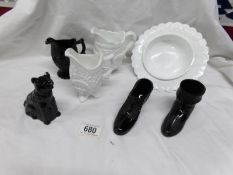 A mixed lot of black and white glass jugs etc