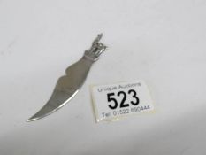 A silver bookmark / letter opener,