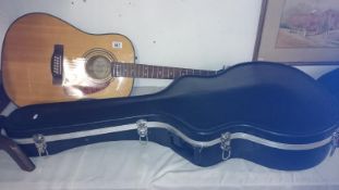 A Fender 12 string electric acoustic guitar in hard case