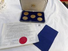 A cased set of 5 silver gilt Royal Albert Hall centenary coins with certificate