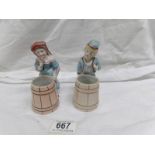 A pair of 19th century continental porcelain figure spill vases