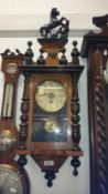 A mahogany wall clock