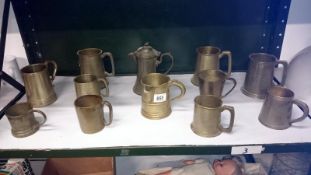 A quantity of pewter tankards etc