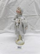 A 19th century continental porcelain figurine of a tuba player