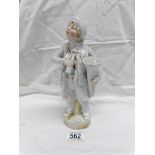 A 19th century continental porcelain figurine of a tuba player