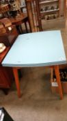 A formica topped draw leaf table