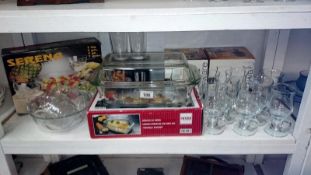 A shelf of glass ware