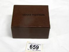 A small Louis Vuitton box