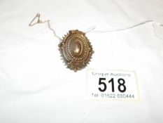 A Victorian yellow metal mourning brooch with lozenge mark