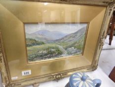 A framed and glazed watercolour country scene with sheep