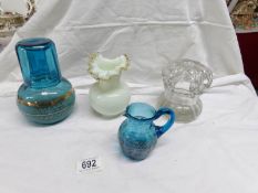 A hand decorated blue glass water carafe with tumbler,