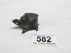 A carved horn snuff box in the shape of a tortoise
