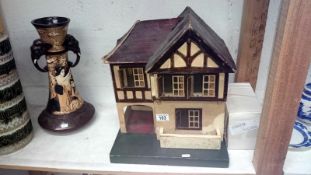 A Tri-ang dolls house with accessories
 
There is no woodworm evident