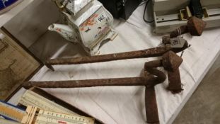 A pair of 19th century iron fire dogs/boot scrapers