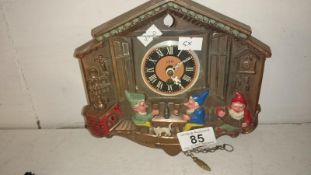 A vintage metal cuckoo clock