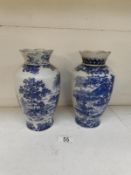 A pair of limited edition blue and white vases made ofr  B W L Ltd.