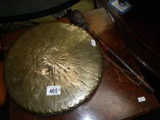 A brass gong and striker