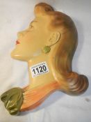 A 1940's plaster wall head (11.