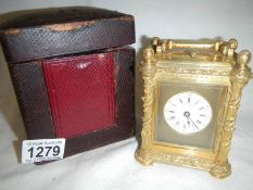 A cased repeater carriage clock marked on dial 'Hunt & Roskell',