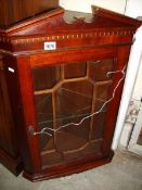 A small old mahogany hanging corner unit with shaped shelves