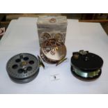 A boxed Ikonix central pin wheel fishing reel,