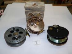 A boxed Ikonix central pin wheel fishing reel,