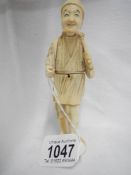 An unusual antique ivory figure 'silk box'