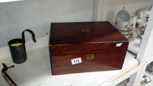 A rosewood veneered box with brass insets containing packs of playing cards