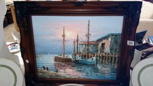 An oil painting of fishing boars signed W Jones,