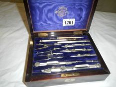 A fine boxed protractor set in rosewood case,